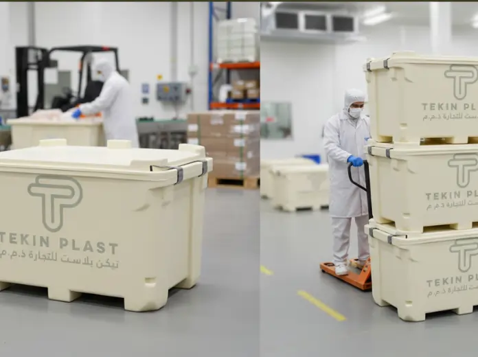 Reusable industrial plastic tubs being handled in a controlled facility, supporting plastic tub recycling and sustainable packaging systems